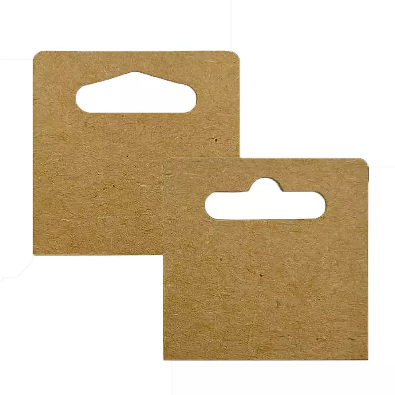 Two self-adhesive Kraft paper hang tabs for retail display: one with a Euro hole and one with a Delta hole. Eco-friendly brown paper hang tabs for product packaging.